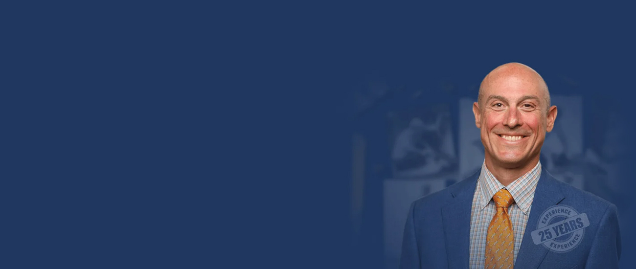 Jonathan Rosenfeld with a dark blue background